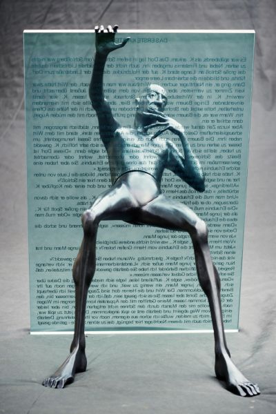 Kafka reader - forged sculpture (2013). Material: glass, metal - height 115 cm.